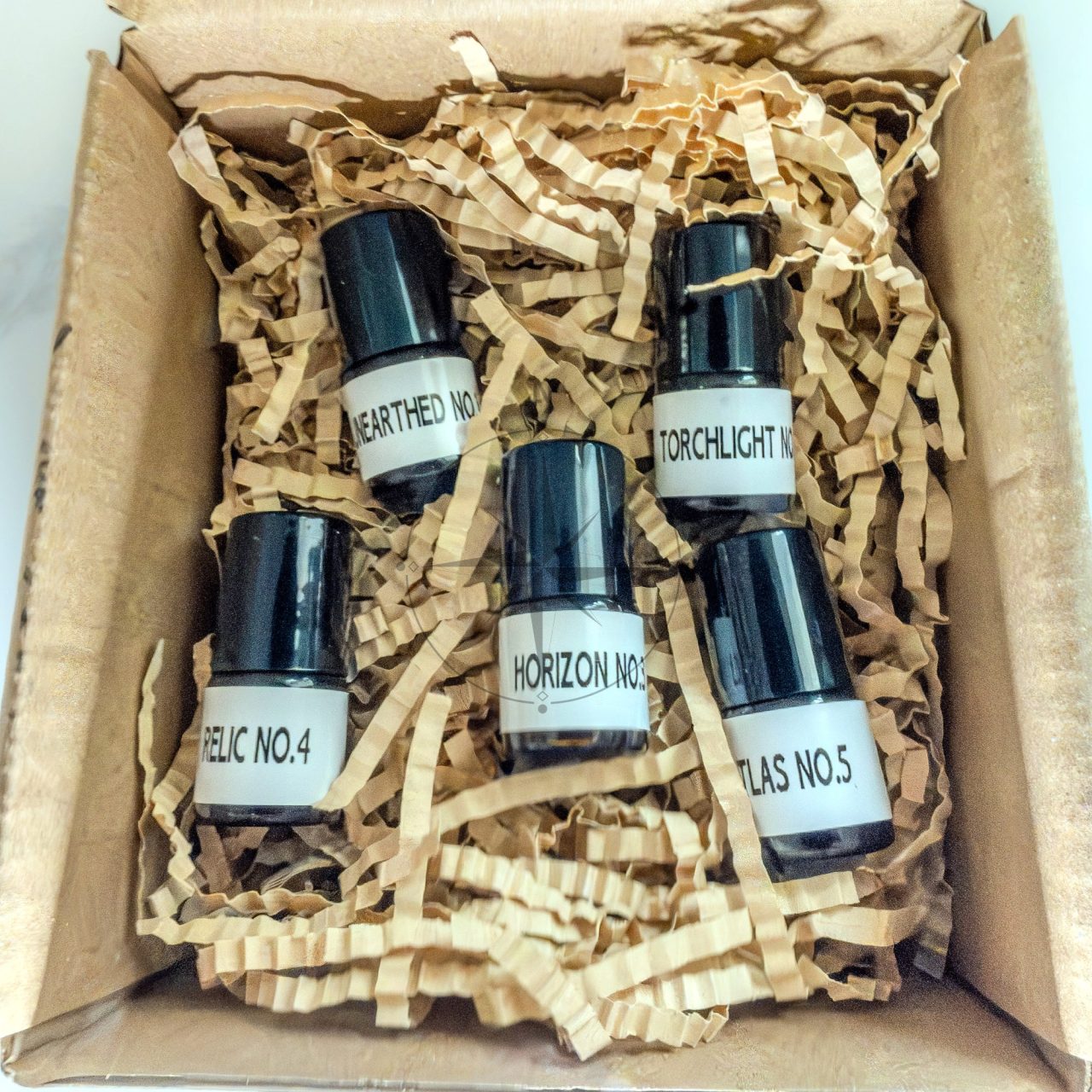 Gift box of five sample bottles labelled Expedition Collection: Unearthed, Torchlight, Horizon, Relic, and Atlas